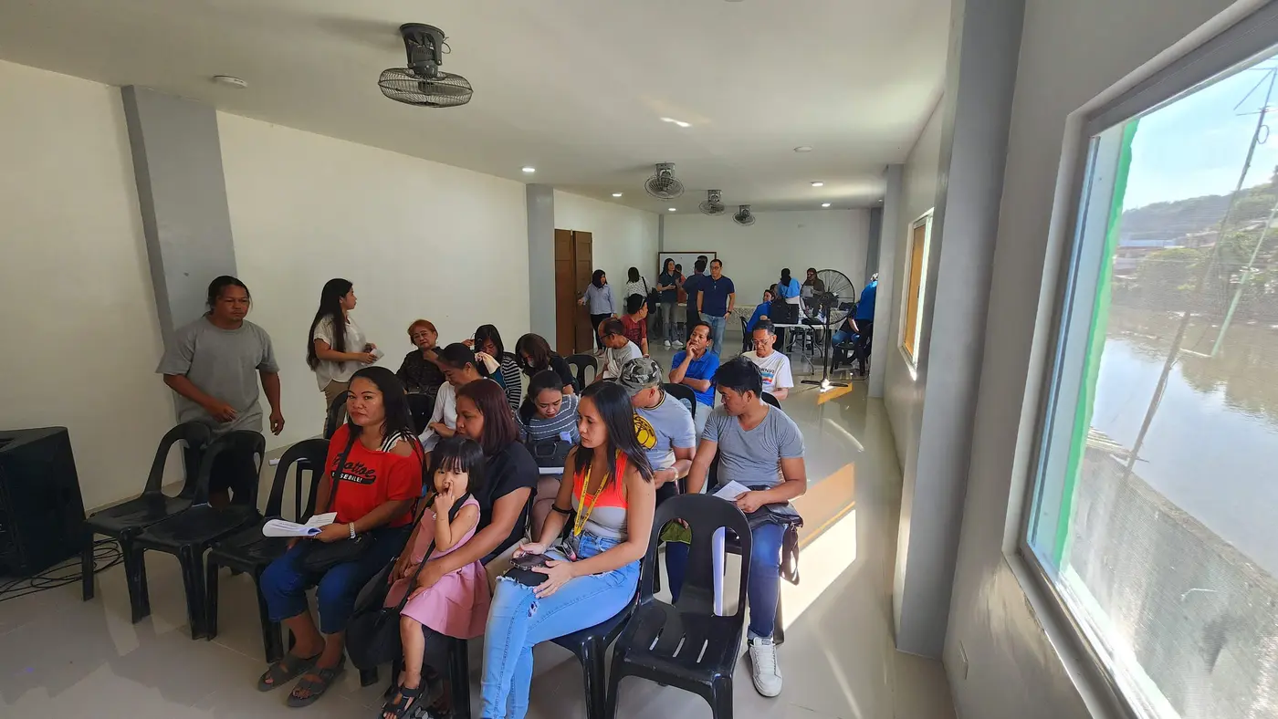 Workers arriving for a community assembly